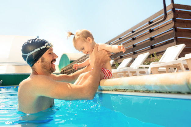 happy-family-having-fun-by-swimming-pool_155003-3154